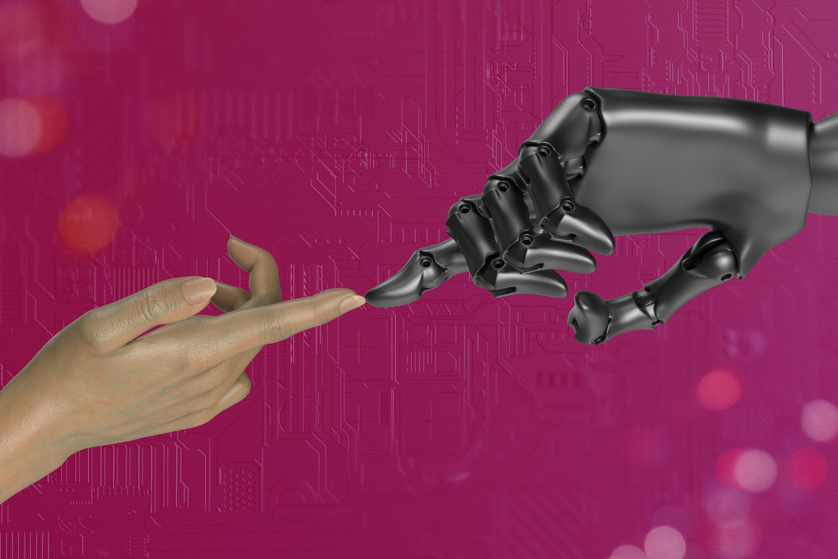 The image is a photograph that features a human hand, which appears to be reaching out towards an artificial humanoid hand. The human hand has painted nails and is wearing a ring on the middle finger. Both hands are making the gesture of giving the peace sign. In the background, there's a blurred pink surface with some indistinct items or shapes that resemble electronic components or circuitry, suggesting a futuristic or technology-related theme. The style of the image is a blend of realism and digital manipulation, possibly aiming to convey a theme related to artificial intelligence, human-machine interaction, or the future of robotics.