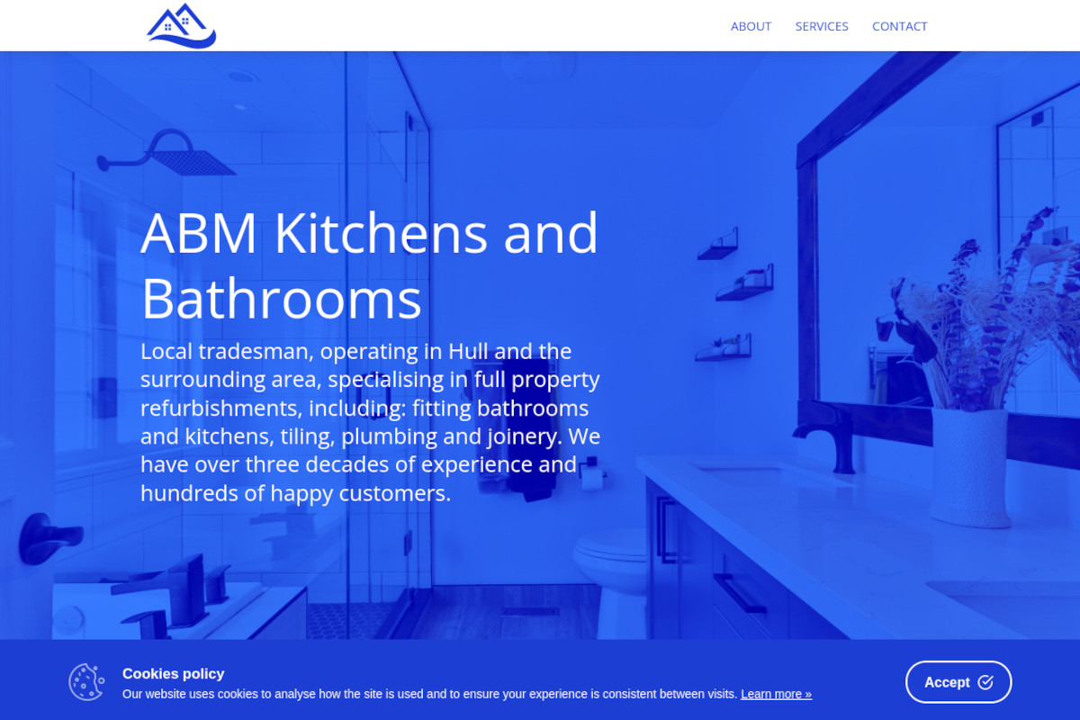 A screen shot of the homepage for ABM Kitchens and Bathrooms. It shows a photo of a contemporary bathroom design, with a shower cubical on the left and a toilet on the right, with a blue filter applied to the entire image. The words 'ABM Kitchens and Bathrooms. Local tradesman, operating in Hull and the surrounding area, specialising in full property refurbishments, including: fitting bathrooms and kitchens, tiling, plumbing and joinery. We have over three decades of experience and hundreds of happy customers' are shown over the image.