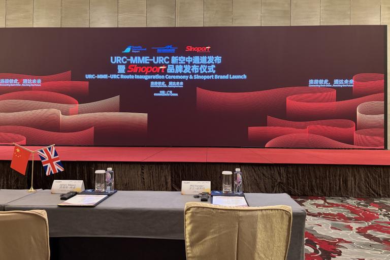 A very large screen, shows the caption URC-MME-URC Route Innoguration Ceremony & Sinoport Brand Launch